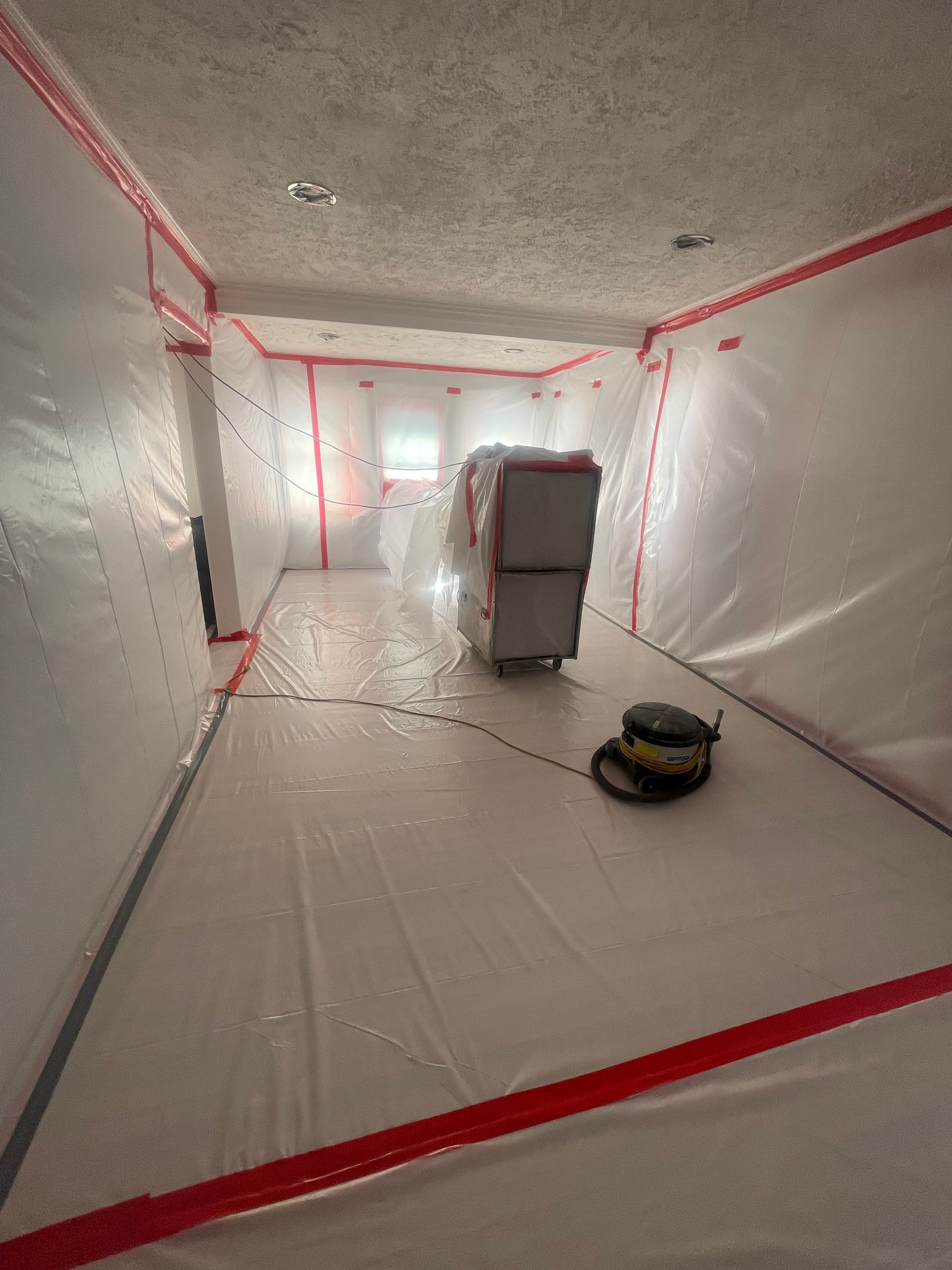 Asbestos popcorn ceiling removal in progress
